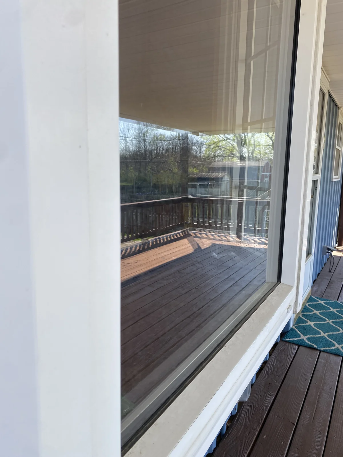 Before: sliding door and screen in Franklin home before cleaning