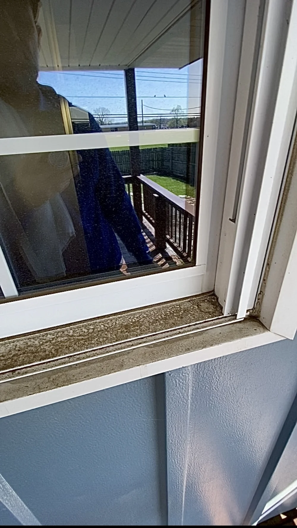 Before: window tracks and sill in Franklin home before cleaning
