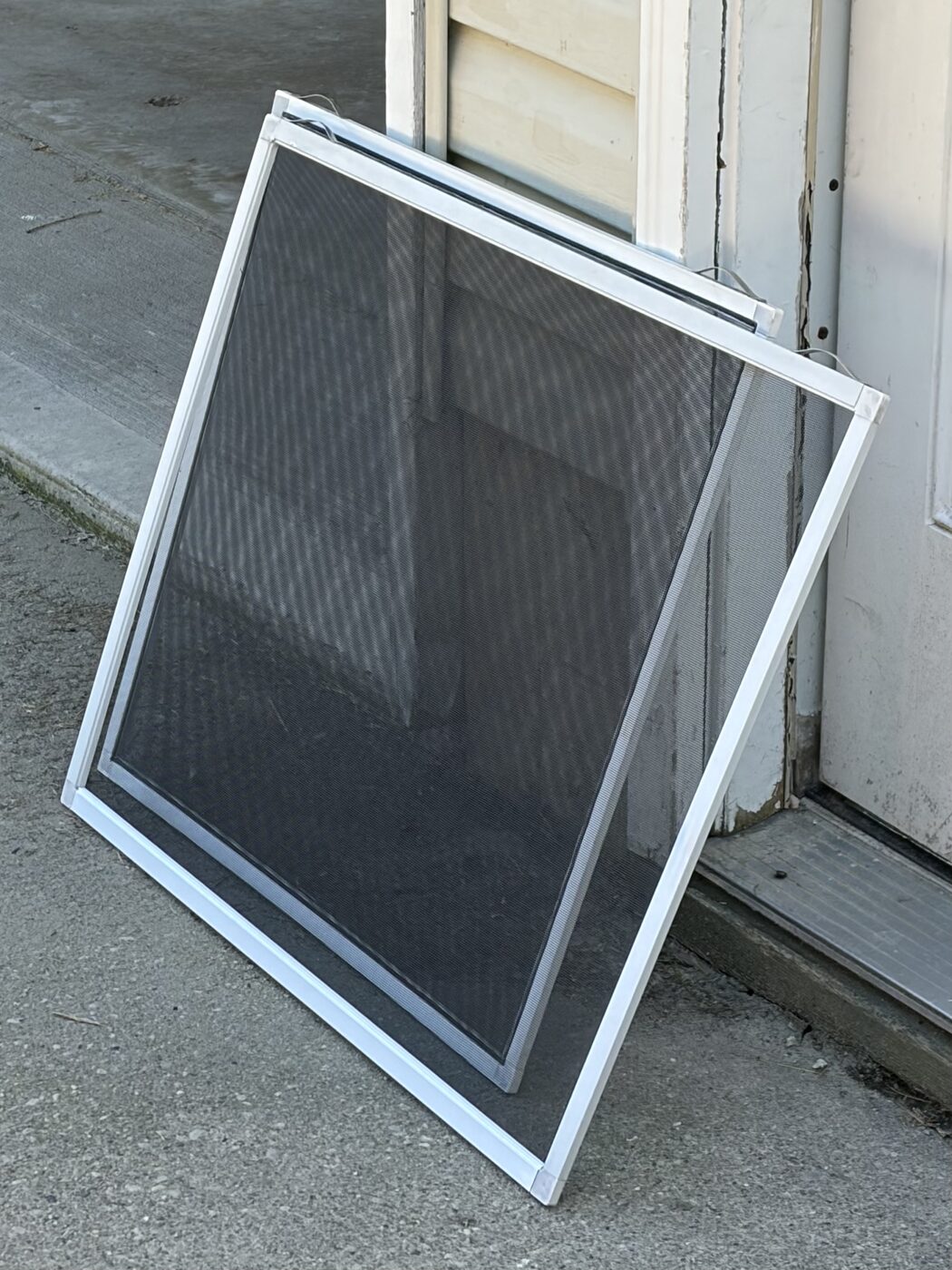 After screen repair — new window screen installed