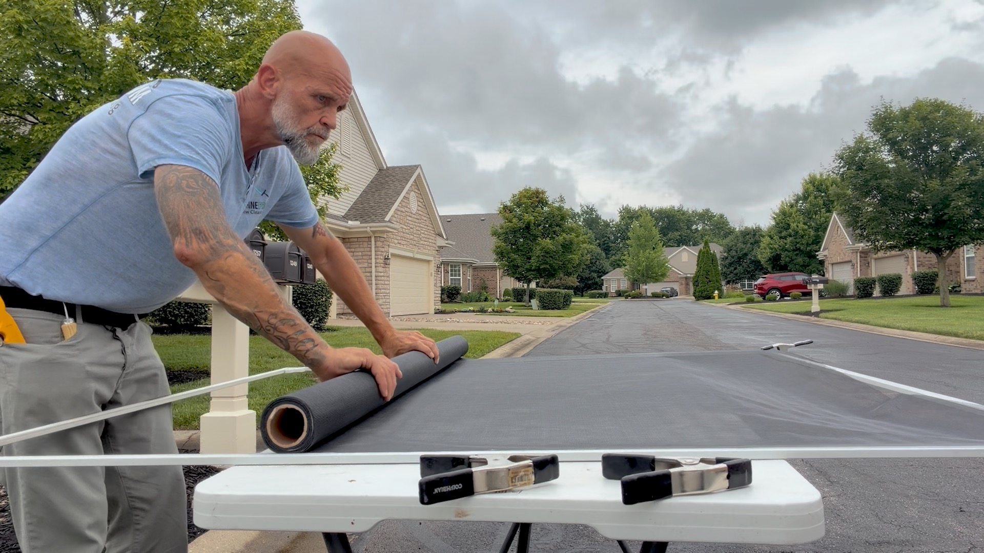 Shawn measuring and positioning new screen mesh in Centerville, Ohio