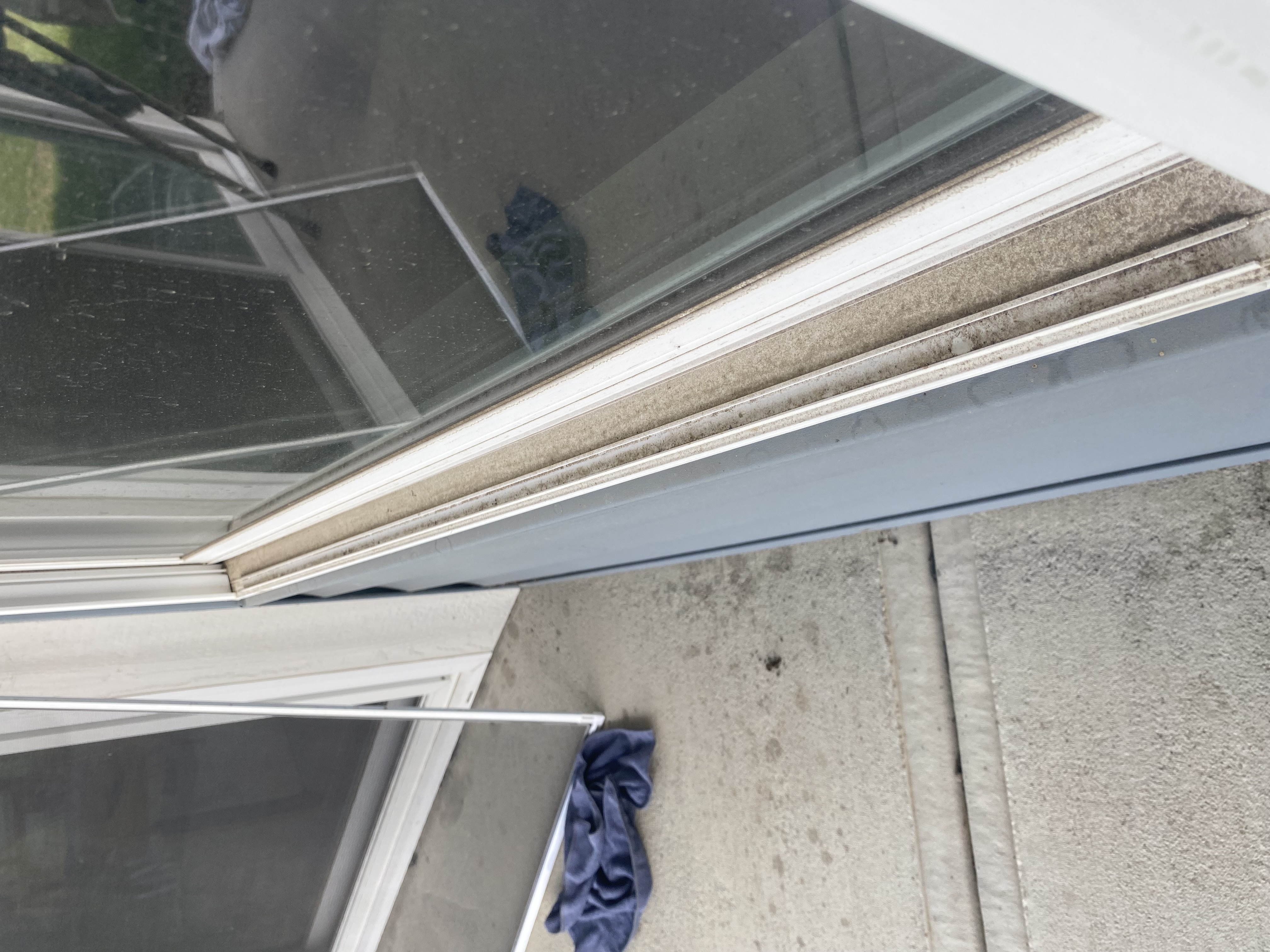 Before window cleaning — dirty window tracks at a Springboro, OH home